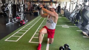 Video Thumbnail: How To Perform A Kneeling Dumbbell WoodChopper Exercise